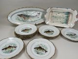 many plates that have fish on them on them