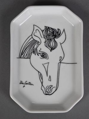 a white plate with a drawing of a horse on it