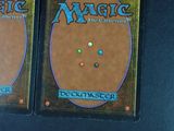 two decks of magic the gathering card game on a table