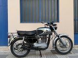 a motorcycle that is parked in front of a building