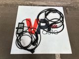 a sign that has a bunch of wires attached to it