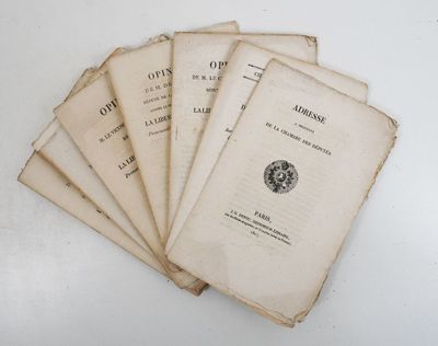 six old books sitting on top of each other on a table
