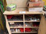 a wooden shelf with a bunch of tools on top of it