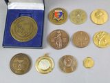 a lot of medals that are sitting on a table