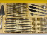 a box with a bunch of knives and knives in it