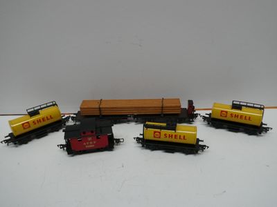 five toy trains that are lined up on a table
