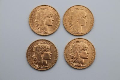 four gold sovereigns, one of which is a woman and one of which is a man