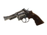 a close up of a revolver on a white background