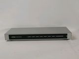 a close up of a dvd player sitting on a white surface