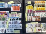 a lot of stamps on display in a display case