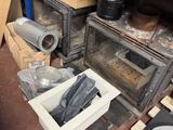 a small oven sitting in the middle of a room filled with boxes