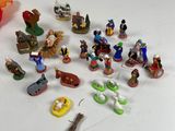 a lot of figurines that are on the table