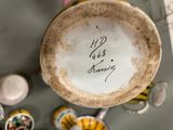a cup with a name on it sitting on a table
