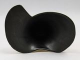 a black object that is sitting on a white surface