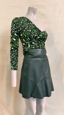 green leopard print top and black leather mini skirt
