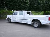 a white truck that is parked in a parking lot