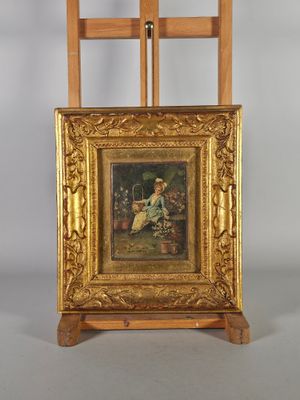 tableau représentant une femme assise sur une chaise devant un chevalet