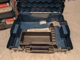 a blue tool case with a piece of paper inside of it