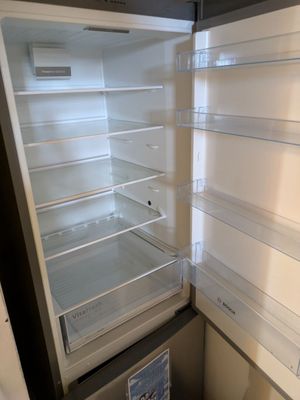 an open refrigerator with the door open and the freezer door open