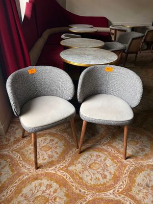 two chairs and a table in the corner of a room