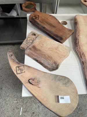 several pieces of wood are sitting on a table in a room
