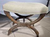 a small bench with a cushion on top of it