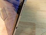 a cell phone that is sitting on a wooden table