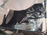 a baby in a stroller that is covered by a sheet