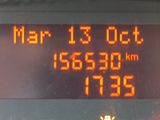 a digital clock on the side of a bus