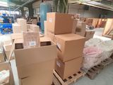 many boxes stacked on pallets in a warehouse