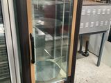 an image of a refrigerator with a glass door in a store