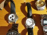 a lot of watches that are sitting on a table