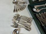 a box of silverware on a table with spoons and spoons