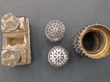 four different types of metal items on a table