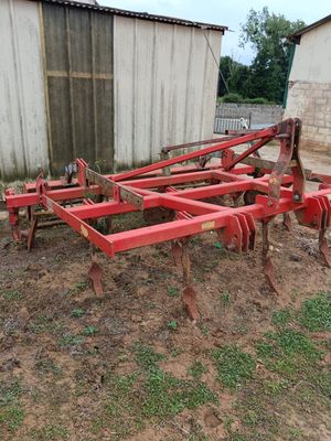 an image of a tractor plow in a field