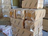 many boxes stacked on top of each other in a warehouse