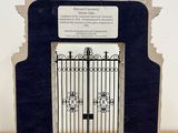 a picture of a picture of a gate with a plaque on it