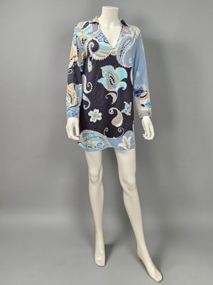 a mannequin mannequin wearing a black and blue paisley print dress