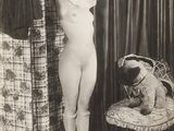 black and white photograph of a naked woman standing next to a teddy bear