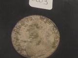une photo d'une pièce de monnaie sur laquelle figure une date