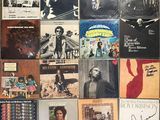 a wall full of various albums and cds