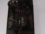 an old sewing machine that is sitting on a table