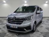 the white van is parked on a checkered floor in a room