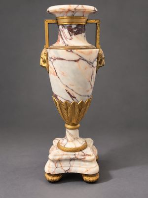 an image of a white and gold vase sitting on top of a table