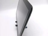 a tablet that is sitting on a stand on a table