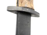 a close up of a knife with a wooden handle