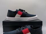 men ' s black sneakers with red, white and blue stripes on them