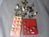 a lot of coins and a book sitting on a table
