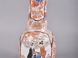 a vase with a picture of a man and a woman on it