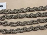 several strands of silver colored thread are on a table